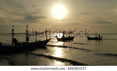 Fishing boats in the morning sun in Hua Hin Thailand