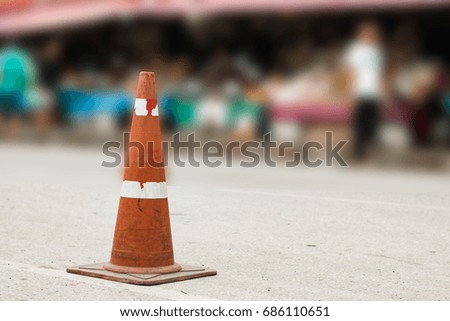 parking lot with traffic cone on street