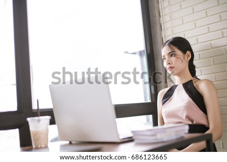 Asian woman thinking depress sad alone during working job. Absent-minded concept.