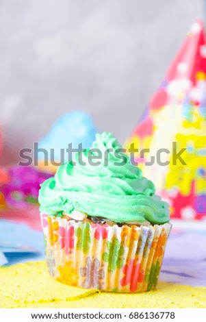 Bright birthday background with Fresh tasty cupcakes and decorations