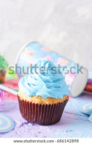 Bright birthday background with Fresh tasty cupcakes and decorations