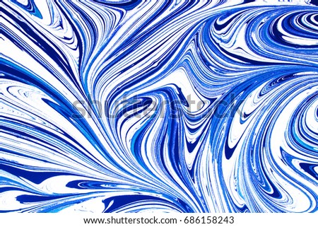 Blue and white paint mixing. Artistic shapes and lines background.