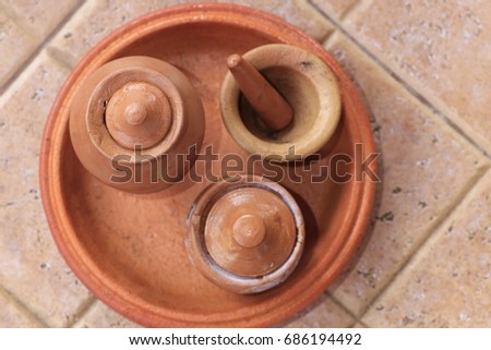 small mortar pots on tray earthenware on brown ground
