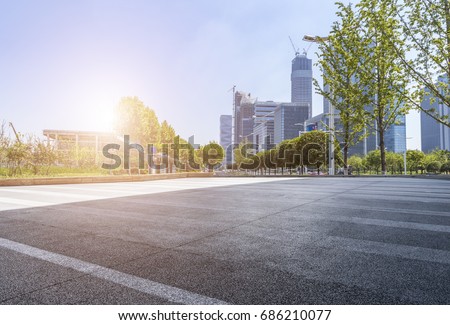 Empty Road with modern business office building 
