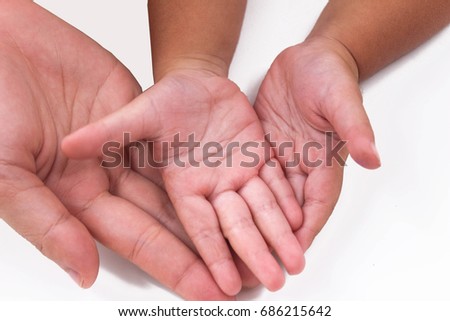 Warming hand of baby and mother is touching each other, this picture is about relation of mother and baby or mother's day or loving.