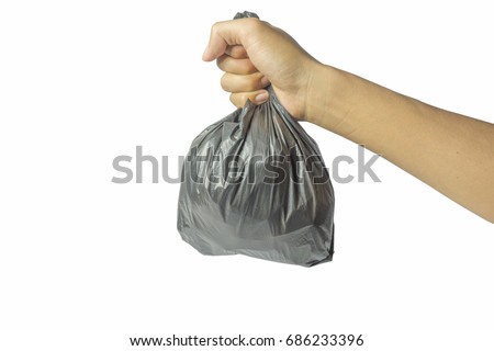 Hands carrying plastic bags Royalty-Free Stock Photo #686233396