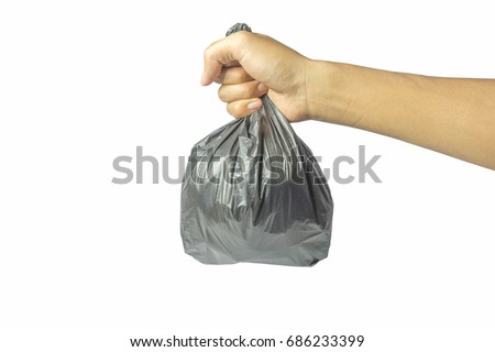 Hands carrying plastic bags Royalty-Free Stock Photo #686233399