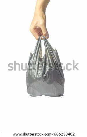 Hands carrying plastic bags Royalty-Free Stock Photo #686233402