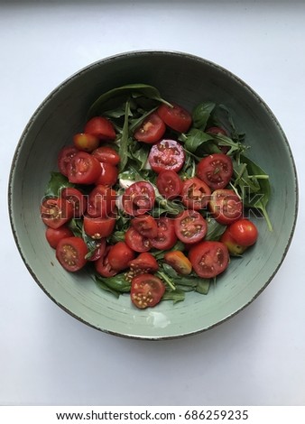 Delicious and pretty homemade caprese calad with cherry tomatoes and mozzarella cheese