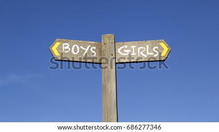 Boys and Girls - Conceptual Signpost Royalty-Free Stock Photo #686277346