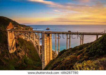 Bixby Bridge (Rocky Creek Bridge) and Pacific Coast Highway at sunset near Big Sur in California, USA. Long exposure. Royalty-Free Stock Photo #686287780
