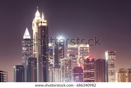 Illuminated Dubai Skyline At Night Against Sky