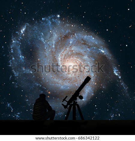 Man with telescope looking at the stars. Pinwheel Galaxy Messier 101, M101 in the constellation Ursa Major
Elements of this image are furnished by NASA.