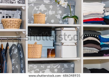 The wardrobe, closet in which everything put in order. All things are folded neatly. Many boxes. Everything is in its place. Harmony. Concept. Interior. Clothing. Underwear. Underwear. Royalty-Free Stock Photo #686348935