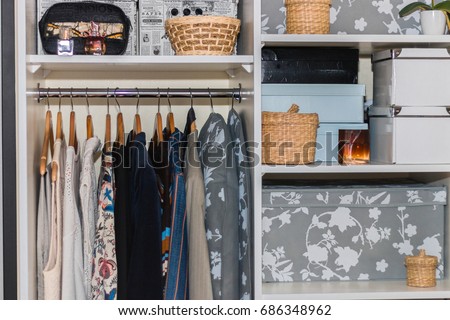 The wardrobe, closet in which everything put in order. All things are folded neatly. Many boxes. Everything is in its place. Harmony. Concept. Interior. Clothing. Underwear. Underwear. Royalty-Free Stock Photo #686348962