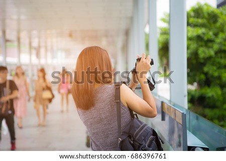 Women photography hold vintage camera on the Pedestrian bridge