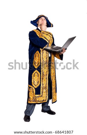 Man in national Kazakh costume with laptop