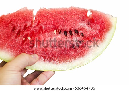 Juicy piece of watermelon in hand. Ripe watermelon. Red and juicy watermelon. Sweet fruit. Sweet berry