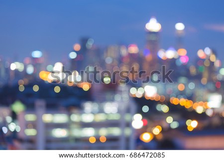 Blue twilight over night blurred bokeh light city downtown abstract background