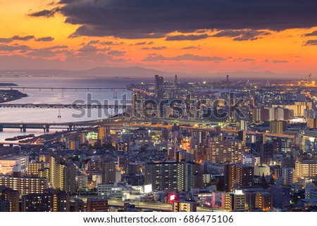 Beautiful sunset skyline background over aerial view Umeda Osaka city business downtown, Japan