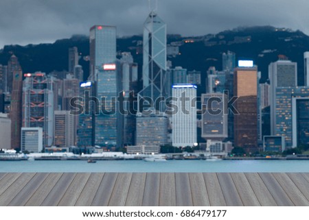Opening wooden floor, Central business downtown blurred bokeh light Hong Kong, abstract background