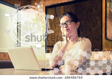 Woman hands uses smart phone and laptop for shopping online from website in modern office or working space. Omni channels concept.