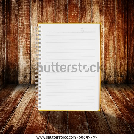 notebook on wood room  for background and text