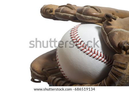 Old worn leather baseball glove and used ball on a white background
