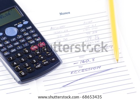 Calculator with notebook and pen - calculations