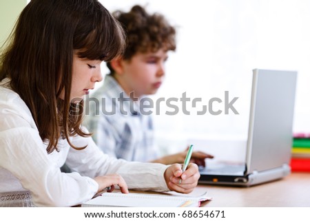 Girl and boy doing homework