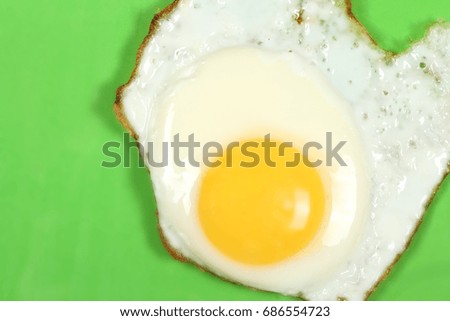 Fried eggs on bright background