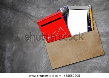 Communication concept, red mail box, mobile phone and yellow pencil on concrete background, Elements of this Image Furnished by NASA