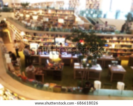 Blurry image of large library in university or school.