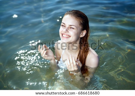 Young beautiful woman is resting on the sea, beach, vacation, ocean, sun, summer.