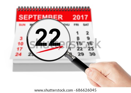 American Business Women's Day Concept. 22 September 2017 Calendar with Magnifier on a white background