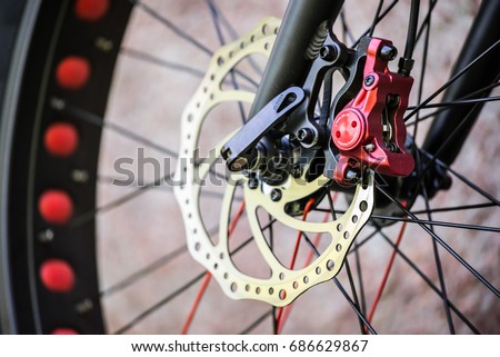 Fat Bike MTB hydraulic front disc brake, close-up Royalty-Free Stock Photo #686629867