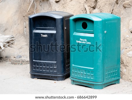 Trash and Recycling Bins in Park Royalty-Free Stock Photo #686642899