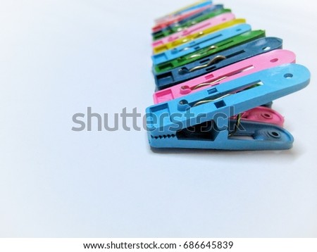 Colorful Plastic clip on white backgroud with copy space.
