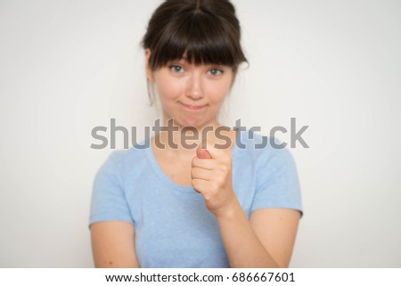 Closeup portrait woman giving thumb, finger fig gesture you are going to get zero nothing. Negative emotions, facial expressions, feelings, body language, signs