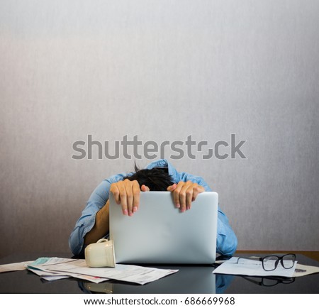 Man crawling on computer laptop, tired and stress of study and work concept Royalty-Free Stock Photo #686669968