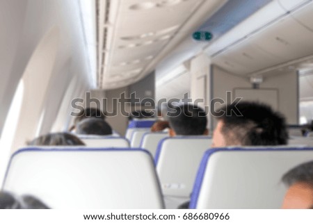 blur of airplane cabin with passenger
