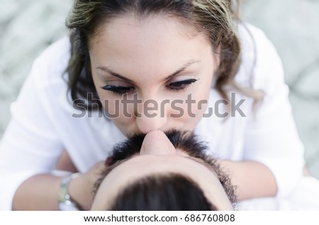above or flat lay view of man and woman kissing, bearded man kissing beauty woman, happy young couple in love, cropped closeup shoot