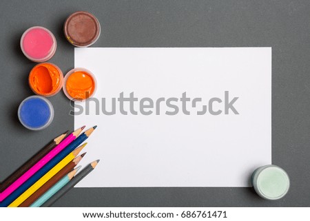 Paints brushes pencils paper colors mock up