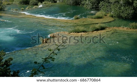 Krka waterfalls cascade in blue lagoon - national park of Croatia