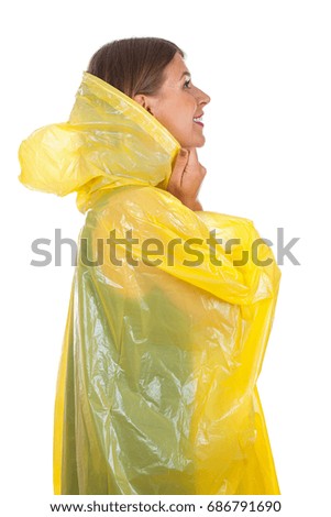  Picture of attractive caucasian woman wearing a yellow raincoat, posing on isolated background