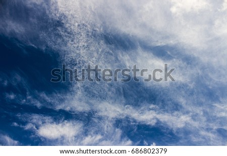 Beautiful white clouds on a blue sky background