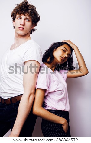 young couple of mixed races girlfriend and boyfriend having fun on white background, lifestyle teenage people concept 