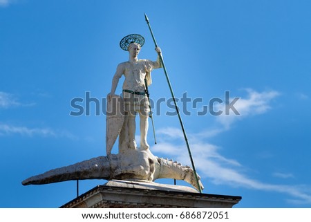 Sculpture of Sacred Teodor - the first patron of Venice standing on a dragon won by it. It is established at column top on Piazza San Marco, Venice, Italy