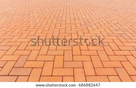 Paver brick floor also call brick paving, paving stone or block paving.
Manufactured from concrete or stone for road, path, driveway and patio. Empty floor in perspective view for texture background.