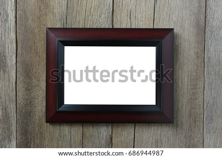 Modern Picture Frame on wooden wall and have copy space for design in your work.